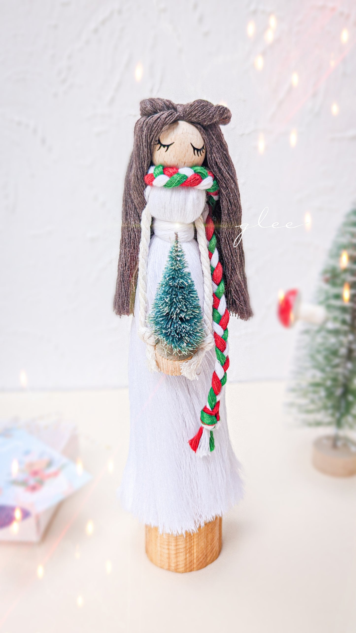 The Christmas Doll with a stand